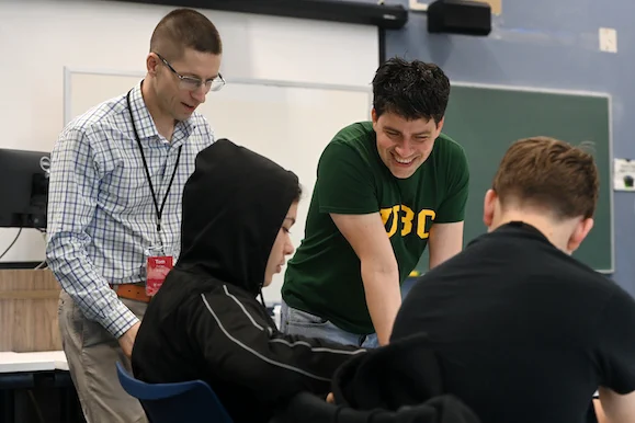 Instructors demonstrate a math activity with students