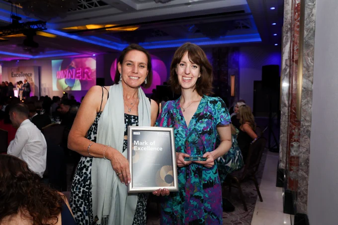 Heather and Caroline at the CIPR awards evening holding the Mark of Excellence framed certificate and award for Oxford Children's Word of the Year