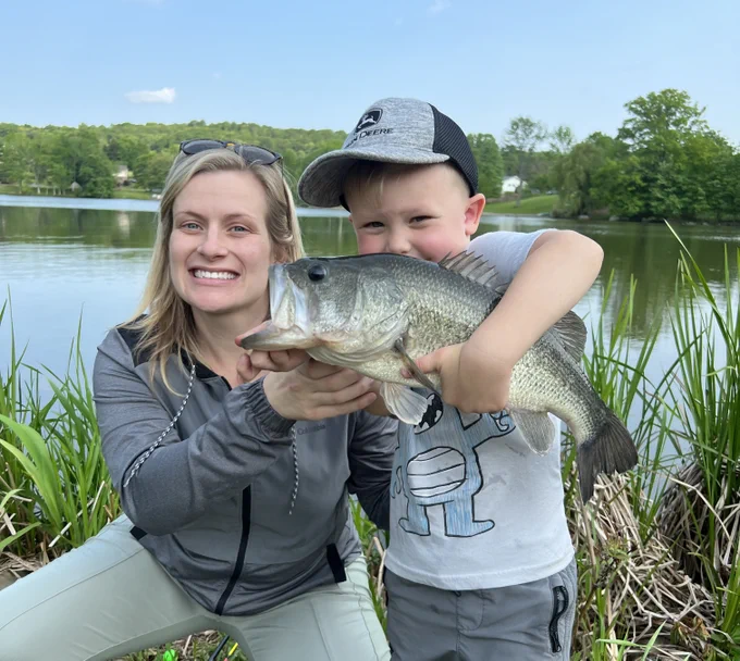 Two happy anglers showing off an impressive fish!