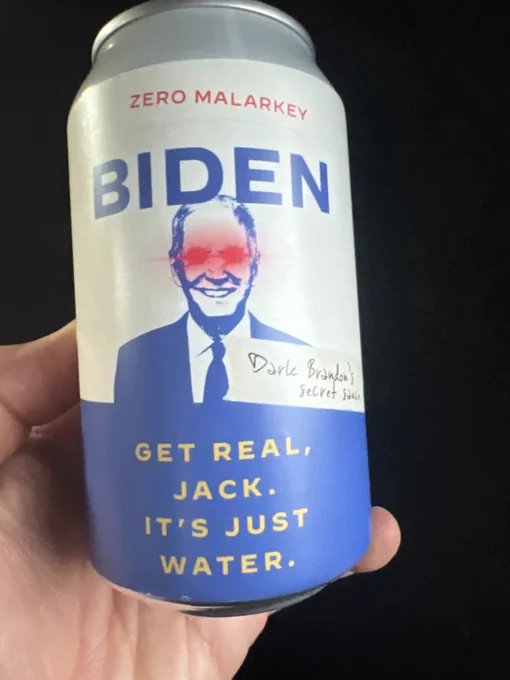 A can labeled "BIDEN ZERO MALARKEY" featuring a photo of Dark Brandon. Text on the can reads "GET REAL, JACK. IT’S JUST WATER."
