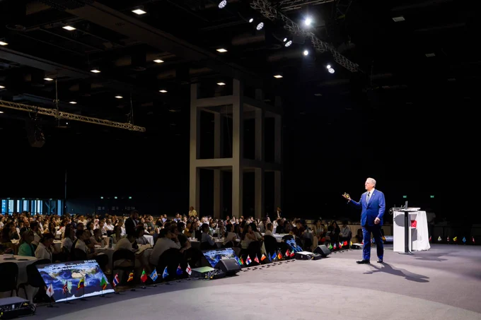 Former U.S. Vice President Al Gore on stage speaking to a room of attendees at the 56th Climate Reality Leadership Training in Rome.