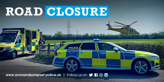 Emergency vehicles - an ambulance, marked police car and a helicopter - and the words "road closure".