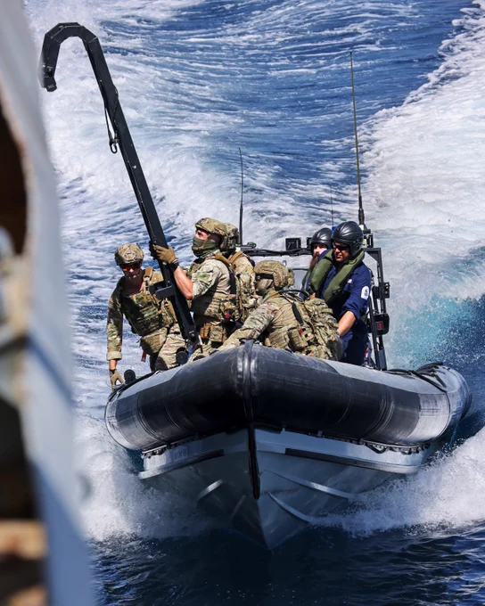 A fast-moving Navy boat.