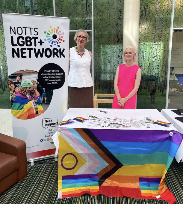 Two volunteers from Notts LGBT  Network on a stand at the RSVIP networking event. 
