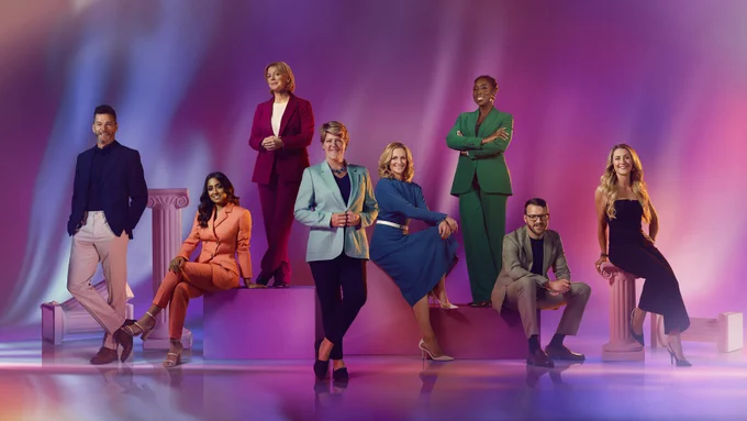 Left to right: Fred Sirieix, Isa Guha, Hazel Irvine, Clare Balding, Gabby Logan, Jeanette Kwakye, JJ Chalmers and Laura Kenny sit on Greek style podiums and columns, against a background with a pink and purple gradient