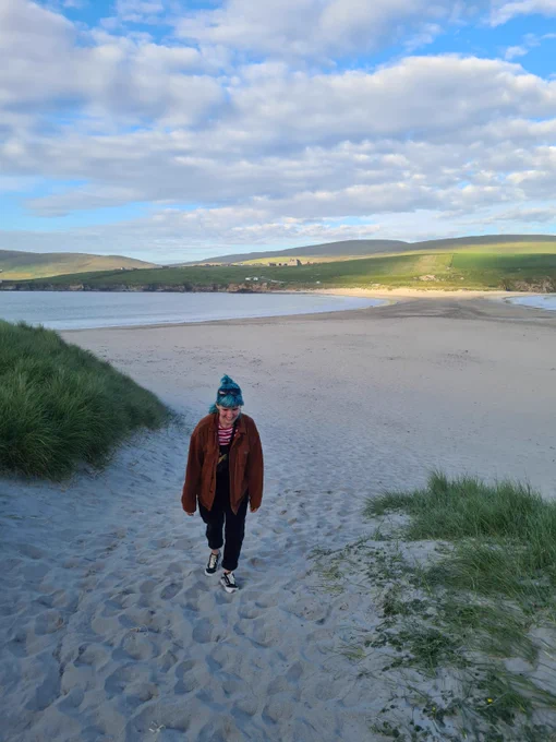 Sadie walking on the beach at St Ninian's Isle, Shetland