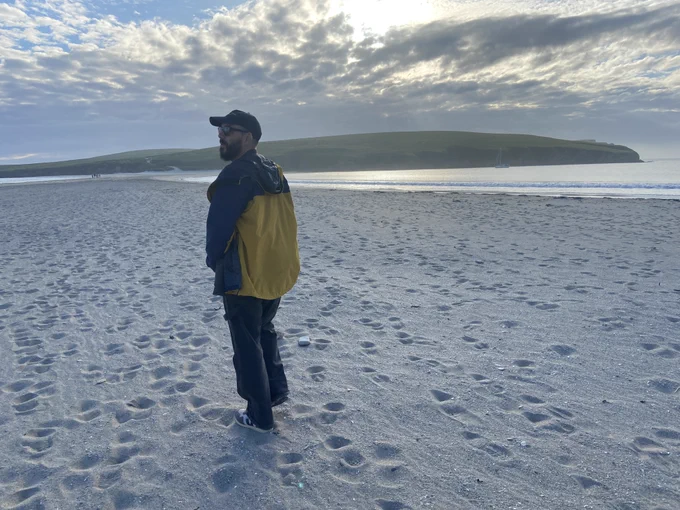 John walking on the beach at St Ninian's Isle, Shetland