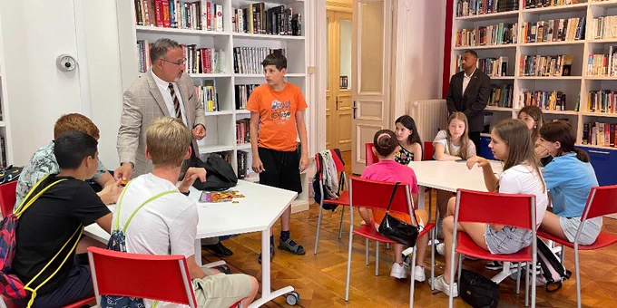 Secretary Cardona interacts with students in an English immersion course at American Corner in Italy during the G7 Education Ministerial Meeting. 