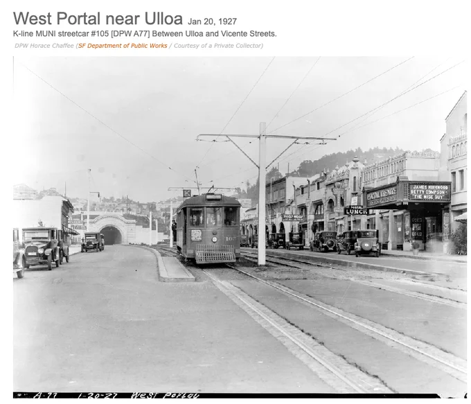 Old photo of train leaving West Portal with concrete curb between trains and cars
