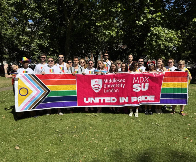 Group of people with a pride banner
