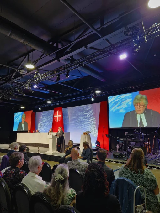 Photo of Revd Helen Cameron speaking on the stage