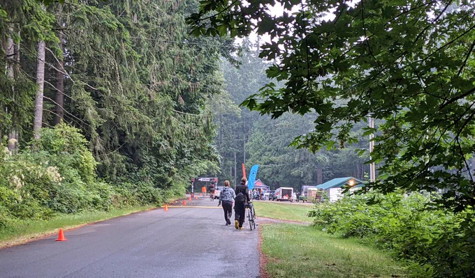 Racers arrive at Fuller Lake in the forest and morning fog.
