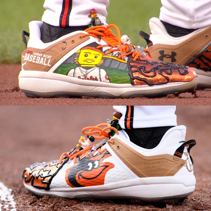 Top photo: A custom baseball cleat featuring a design of Gunnar Henderson as a Lego character, along with actual Legos attached to the shoe.
Bottom photo: A custom baseball cleat featuring the Baltimore Orioles logo designed on the side, along with actual Legos attached to the shoe.