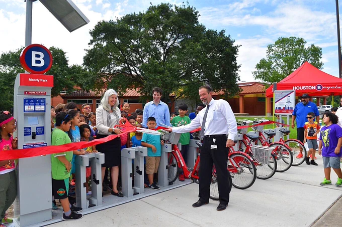 Dignitaries cutting the ribbon on Moody Park stations