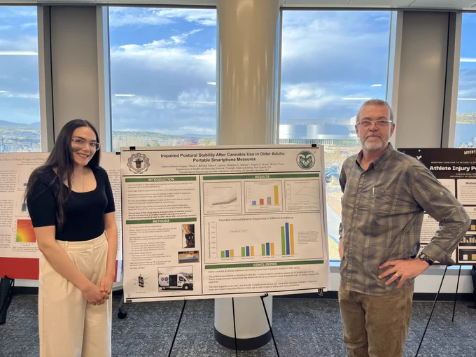 Valeria Salinas-Vargas and her mentor, Brian Tracy, stand in front of her poster at the 2024 CURC presentation.