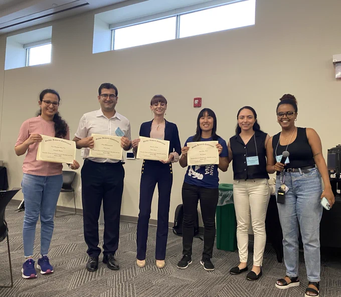 Best poster and presentation award winners holding their certificates