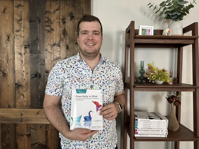 Me posing with "from Ruby to Elixir"