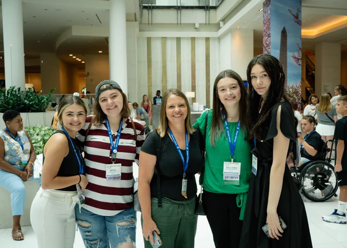 Educator Rising Kentucky students and their teacher leader pose for a picture 