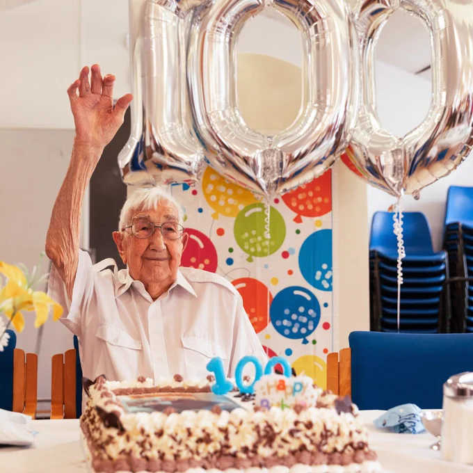 Charlie Hatfield and his cake pictured at his 100th birthday party, at Age UK Ealing Wellbeing Day Centre