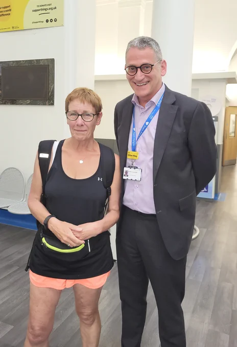 Image of Alex and Clive Kay, CEO of King's College Hospital NHS Foundation Trust. Alex and her colleagues completed a 64-mile overnight walk from King's College Hospital Charity to Hove in memory of her daughter, Charlotte Eades.