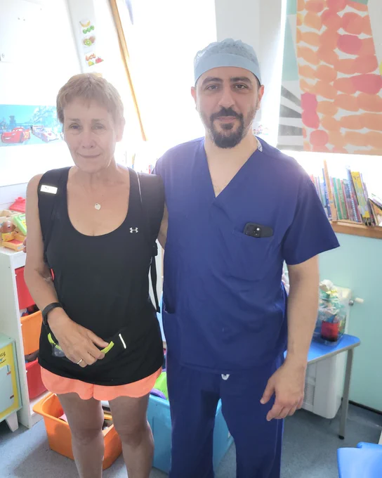 Image of Alex and Bassel Zebian, Consultant Paediatric and Adult Neurosurgeon at King's. Alex and her colleagues completed a 64-mile overnight walk from King's College Hospital Charity to Hove in memory of her daughter, Charlotte Eades.