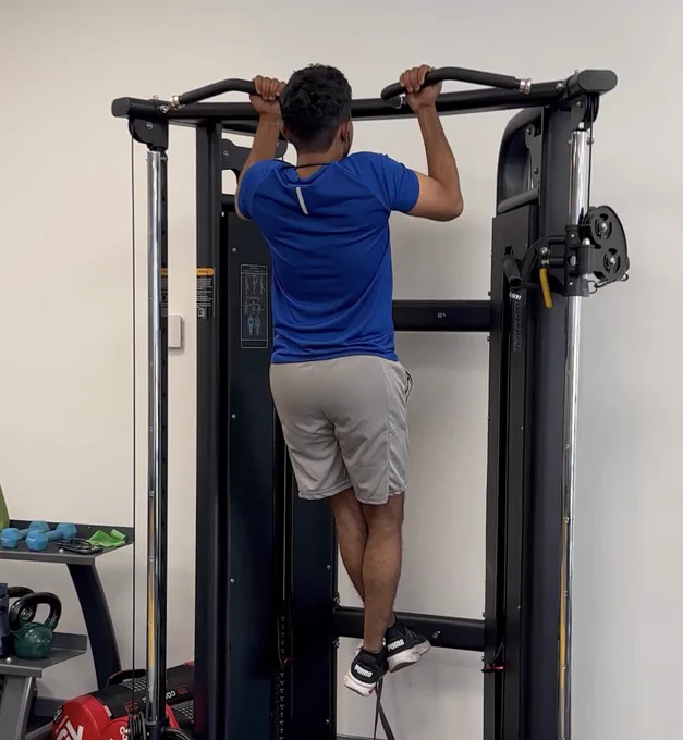 Student doing a pull up