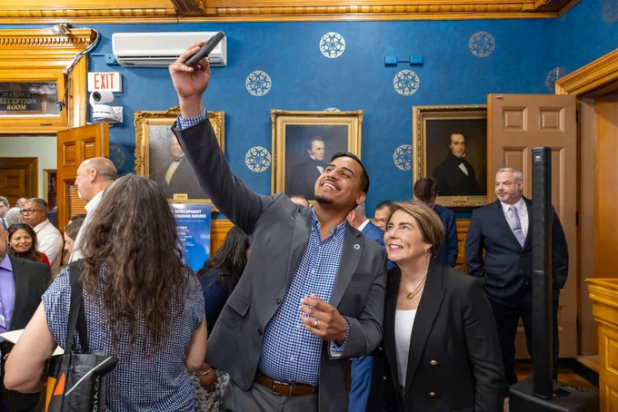 Governor Healey taking selfie with Rep. Manny Cruz.