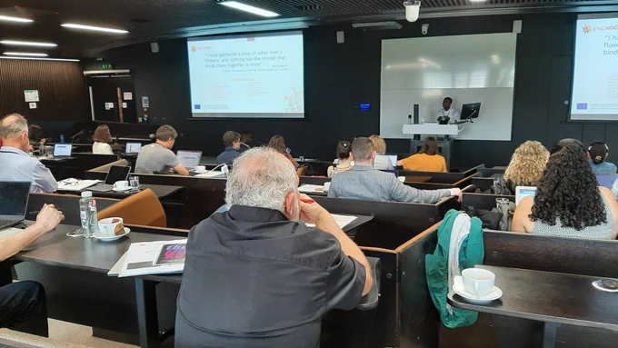 People sitting in a lecture theatre.