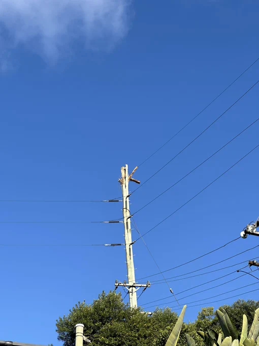 A power pole. The top has been blown apart by a lightning strike.