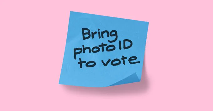 Blue sticky note with text "Bring photo ID to vote" on a pink background.