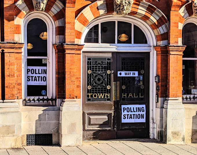 Polling station signs outside an English 19th century town hall