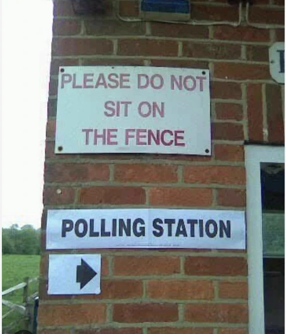 Image of a polling station sign under a permanent sign reading 'please do not sit on the fence'