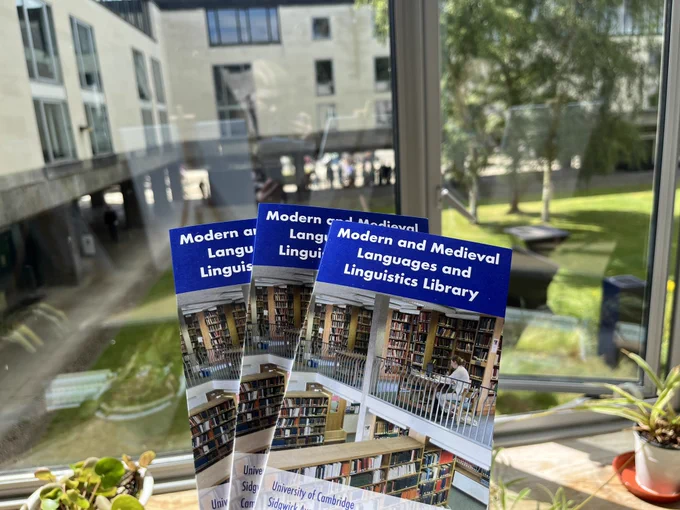 MMLL Library leaflets are held looking out over the RFB grass.