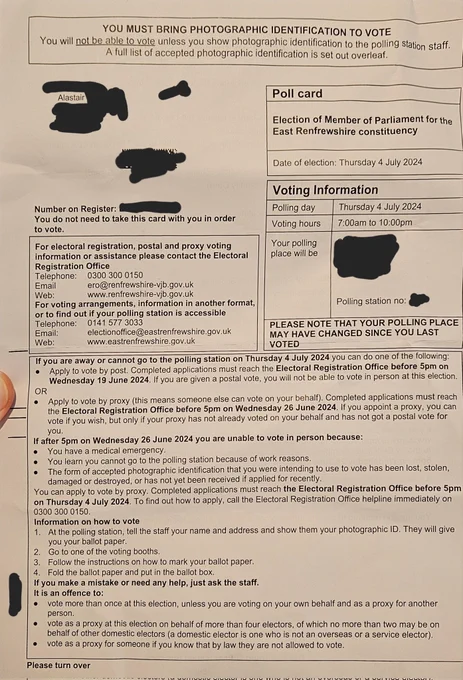 Photo of a UK poll card with personal information redacted
