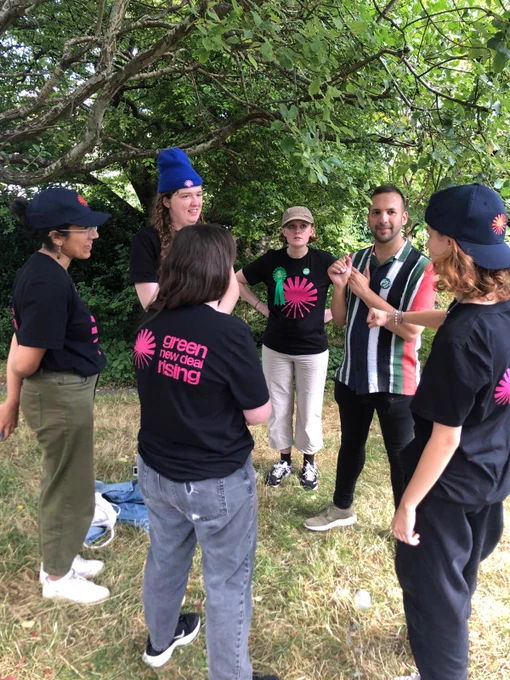 Zack talking to Green New Deal Rising activists 