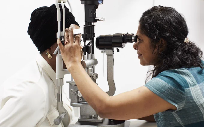 Image of a patient being examined by a consultant.