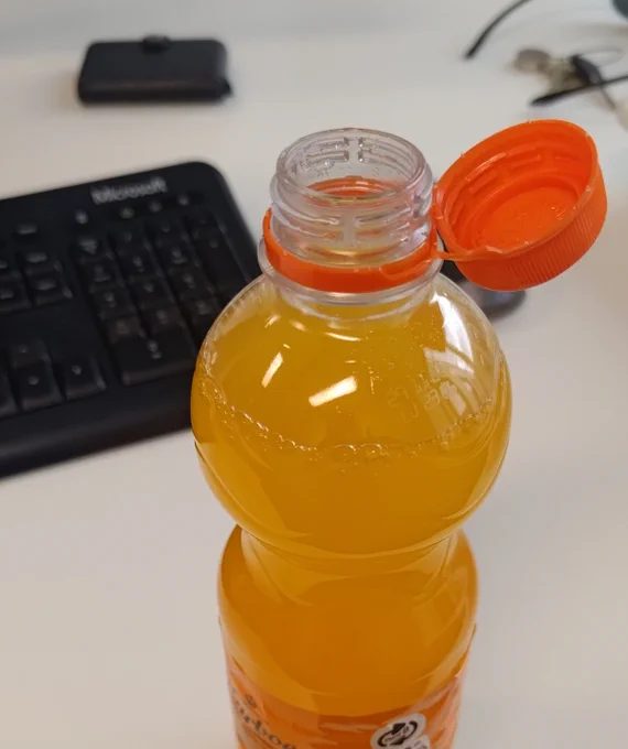 Picture showing a plastic bottle with the new cap attached to bottle.