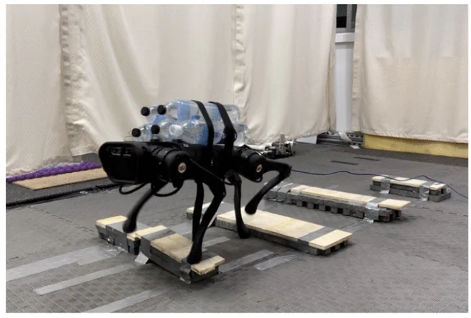 Our proposed adaptive MPC is successfully validated in an experiment on a Unitree A1 robot while carrying an unknown load of 5 kg (almost 50% of body weight) on rough terrain. Experimental results video: https://youtu.be/5t1mSh0q3lk.