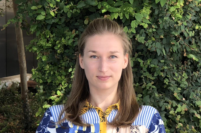 Headshot of Dr. Aleksandrina Goeva in front of greenery