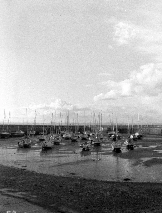 Half frame black and white photograph of Fisherrow Harbour