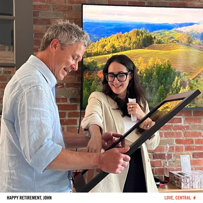 Presenting John with a customized mounted gold record as a retirement gift. 
