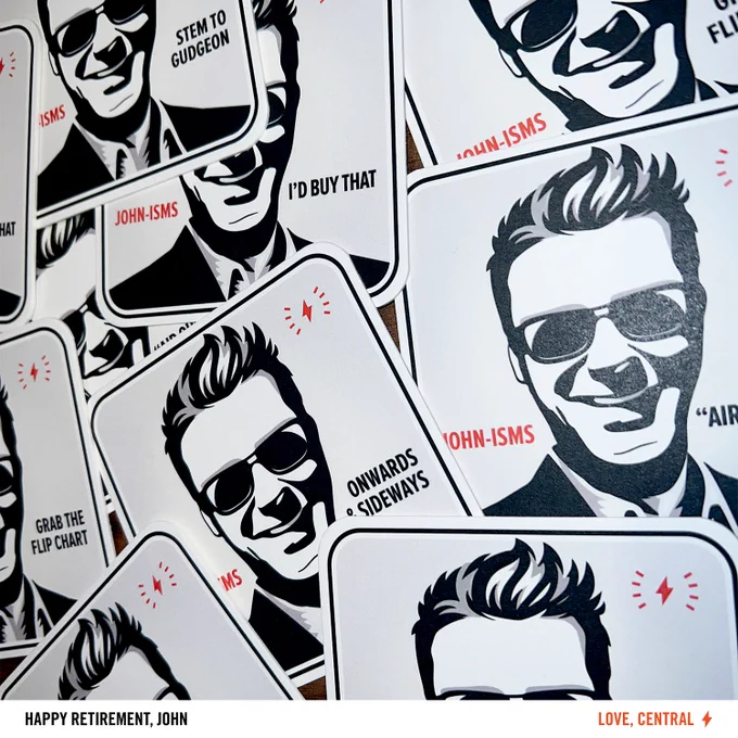 A collection of custom playing cards featuring a stylized portrait of John with sunglasses in various expressions, each card labeled with different phrases like "STEM TO GUDGEON," "I'D BUY THAT," and "ONWARDS & SIDEWAYS." The cards all read "JOHN-ISM"