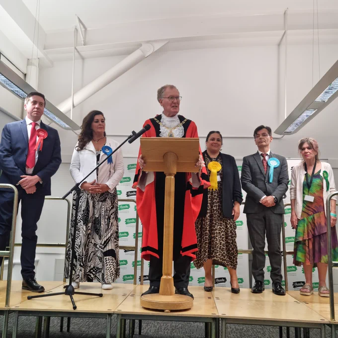 Photo of the Returning Officer, the Mayor of Bromley announcing the election result, with parliamentary candidates on stage.