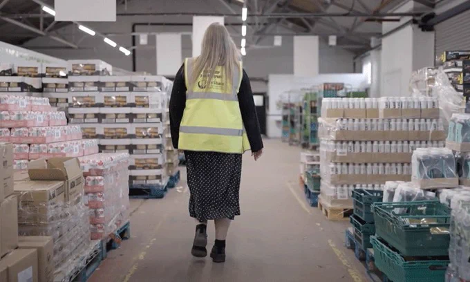 Back of woman walking in food warehouse