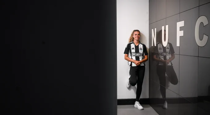 Andrews along side the NUFC lettering at the changing room entrance.