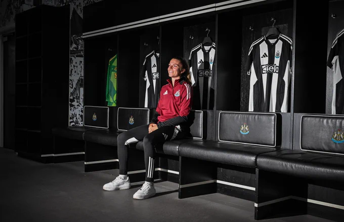 Andrews is photographed in front of Newcastle shirts in the home changing room.