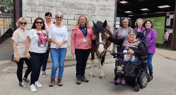 Some of the library staff with a horse at the Equine Centre