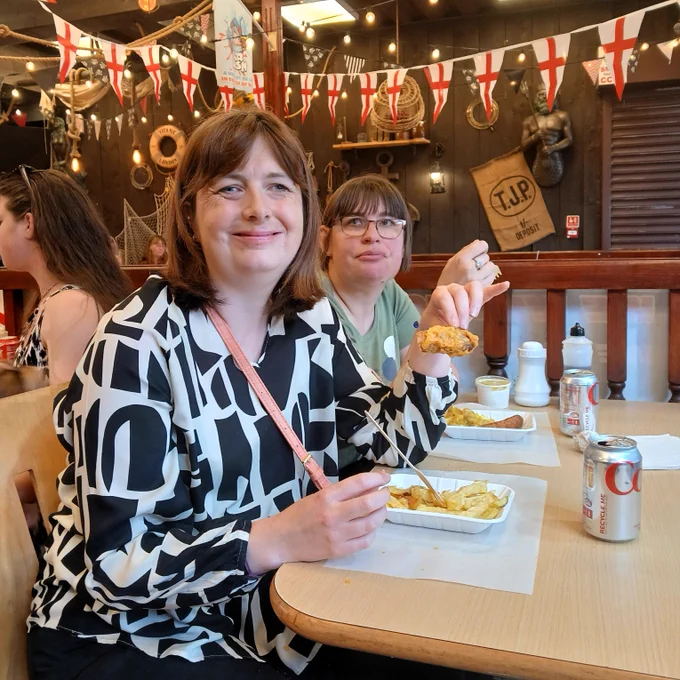 Enjoying some yummy fish and chips.