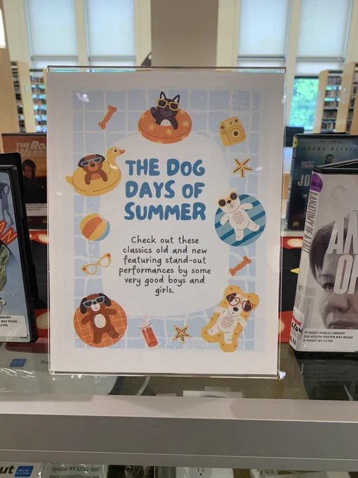 A sign for my display entitled “The Dog Days of Summer,” featuring my favorite performances by pups on film.