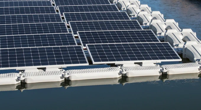 Solar panels floating on the water, with floatation devices around them